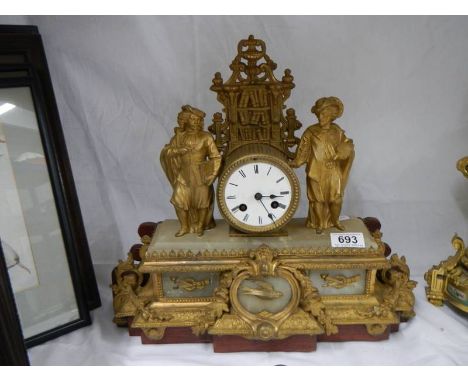 A good gilded spelter mantel clock with alabaster plaques, complete and in working order but has had repair to back platform.