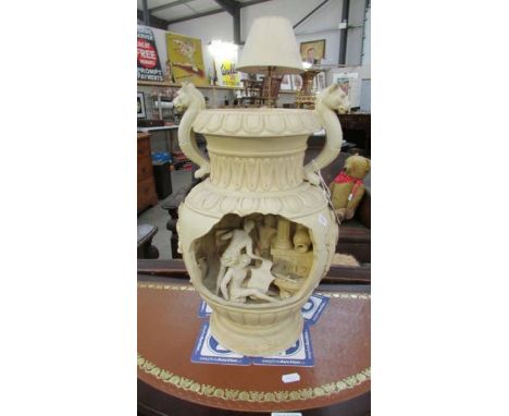 A classical water feature with a light.