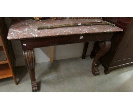 A marble topped console table. ****Condition report**** Width 124cm.Depth 52cm.Height 79.5cm.No visible worm to frame.Frame w