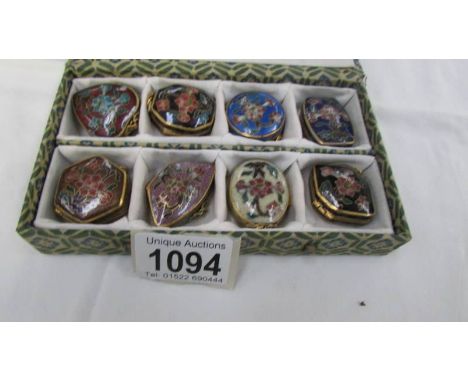 A boxed set of 8 Chinese Cloissonne enamel pill boxes.