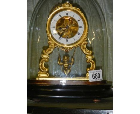 A good French alabaster mantel clock under dome with swinging cherub pendulum, complete and working. ****Condition report****