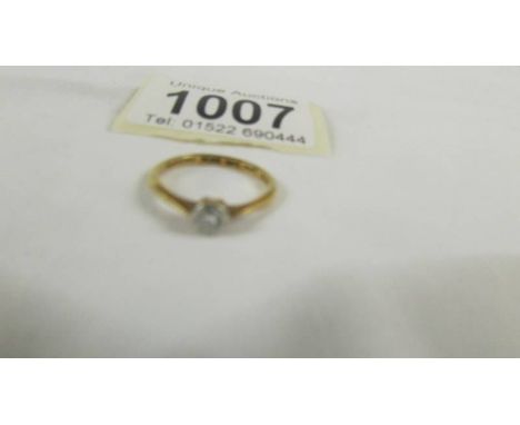 An 18ct gold and platinum diamond ring, marked Tat. No. 202591, W G & G, size M. ****Condition report**** 1/8 of a carat.In f