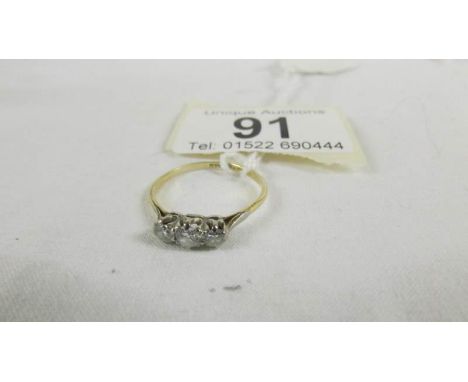 An 18ct yellow gold 3 stone diamond 35pt ring, size P.