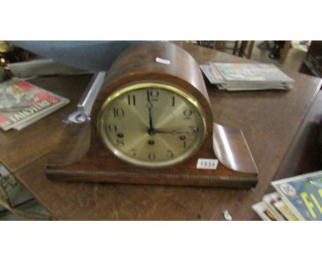 An oak mantel clock.