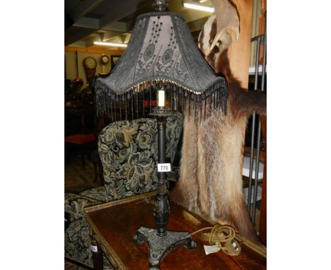 A contemporary table lamp with beaded shade. ****Condition report**** Lamp bases are part iron and part metal painted black.
