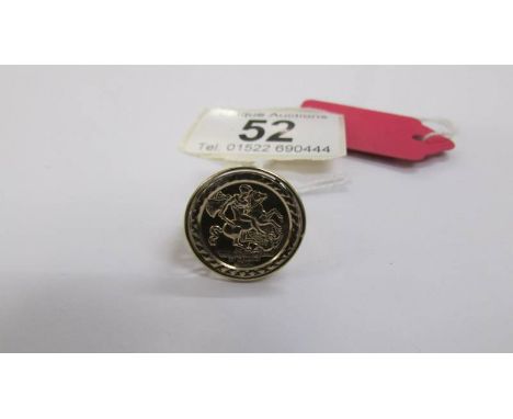 A gold ring with an emblem of George and the dragon, hall marked for Birmingham, total weight 3.2 grams. Size M.