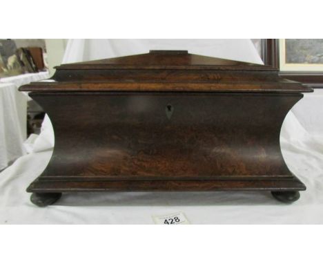 An impressive Georgian rosewood tea caddy with inset storage boxes on bun feet, 16" wide, 10" high and 8" deep. (missing mixi
