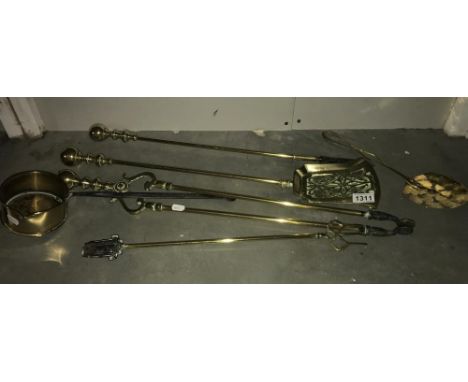 A set of brass fire irons, toasting fork etc.,
