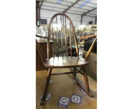 A stick back rocking chair.