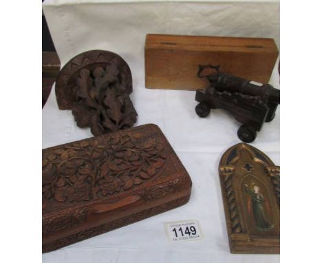 A Black forest wall bracket, a carved wood box, a wooden cannon, a hand painted icon, and another box (a/f). ****Condition re
