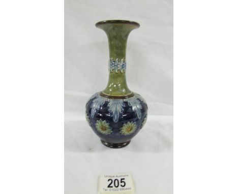 A lovely 19.5 cm tall Doulton Slater vase with narrow neck decorated in a floral pattern with blue, white and gold.  Marked X