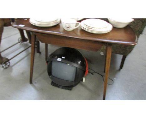 A dark oak Ercol style table.