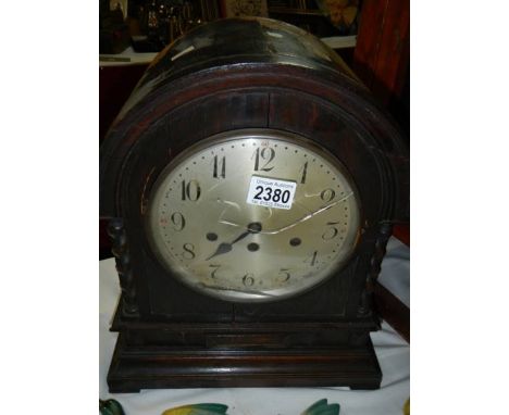 A large oak mantel clock (case needs attention).