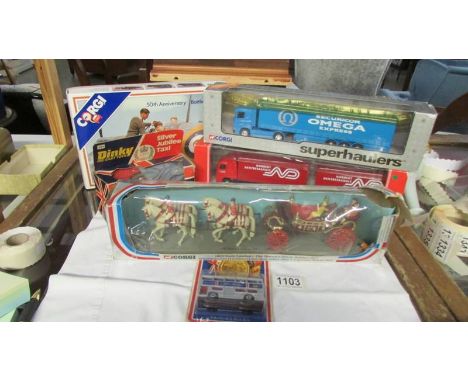 A quantity of boxed Corgi and Dinky including Silver Jubilee taxi, state coach, Battle of Britain 50th anniversary.