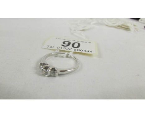 An 18ct white gold 3 stone diamond 30pt ring, size O. ****Condition report**** The diamonds are genuine