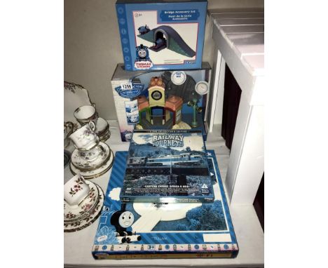 A quantity of Hornby and Ertl Thomas the Tank Engine accessories, railway DVD's and a Chuggington interactive set.