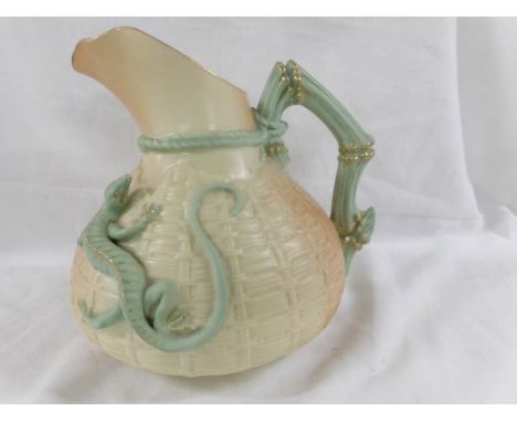 A Royal Worcester jug decorated with  applied lizard.