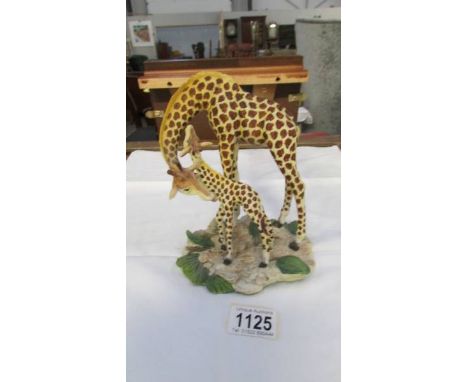 A Goebel giraffe with baby.