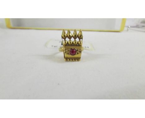 A ring set red stone, size K, (tests as 24ct gold). ****Condition report**** Weight is 3.4gms.