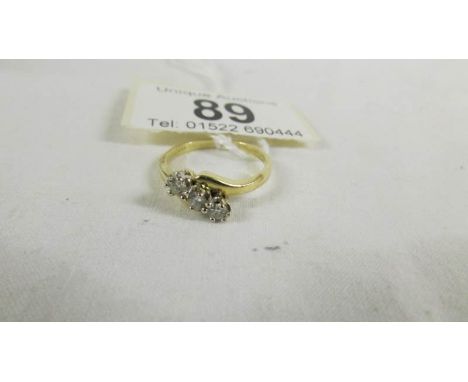 An 18ct yellow gold 3 stone diamond 39pr ring, size M half. ****Condition report**** In good shape, stones are good and secur