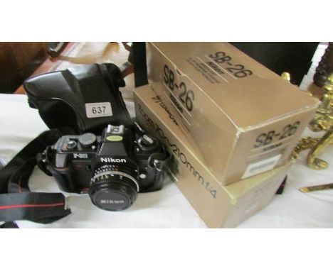 A Nikon IF301 camera, a 70 x 210 zoom lens and an S B 26 speed light.
