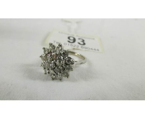 A 18ct floral diamond ring of 1.5 carats, size L half.