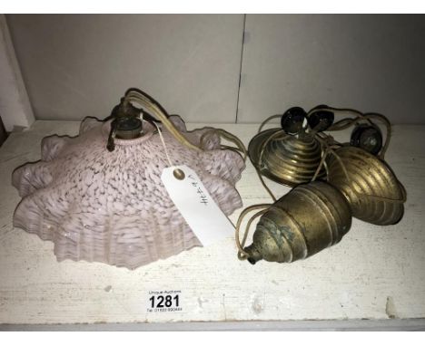 An antique rise and fall light, brass mounted with pale pink frilled shade.