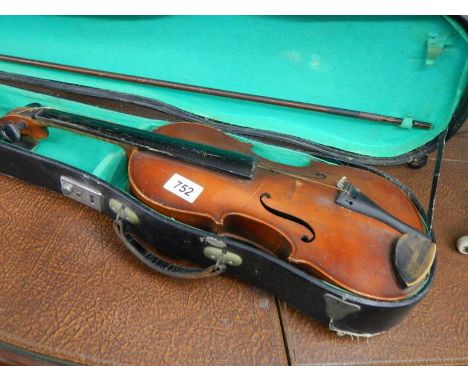 An old cased violin with bow, a/f, (bow signed but indistinct). Label inside reads Antonios Stradivarius Cremonensis Faciebat