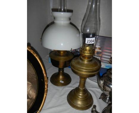 An Alladin oil lamp (complete) and one other.