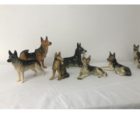 Six ceramic german shepherd figures
