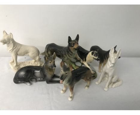 Seven ceramic german shepherd figures to inc Goebel etc