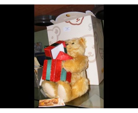 A modern Steiff collectable bear with box and certificate