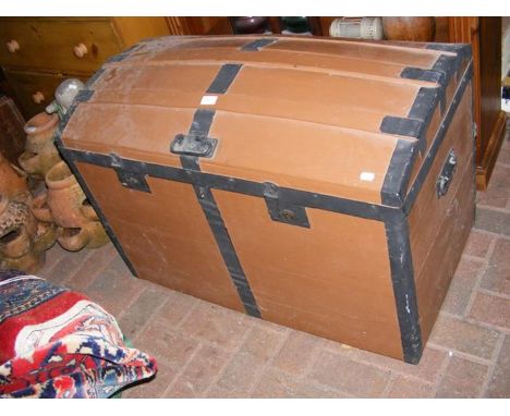 A domed top travelling trunk 