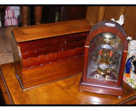 A reproduction mantel clock with visible escapement, together with a stationery cabinet 