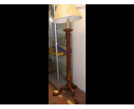 A decorative standard lamp with reeded column