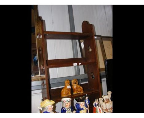 An oak three shelf bookcase