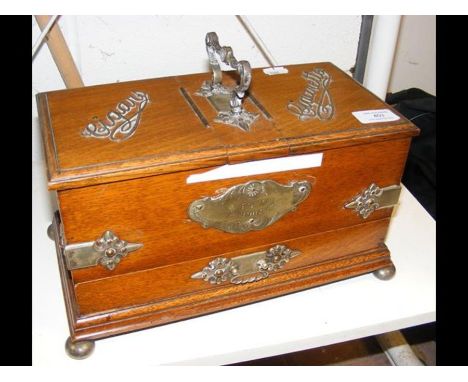 A cigar and cigarette box with cribbage board under 