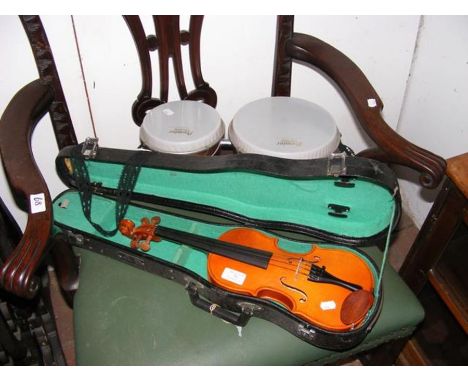 A violin in carrying case, together with a set of bongo drums 