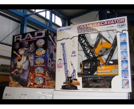 A Radio Controlled Robot - boxed, together with a Ripmax Crane Excavator  