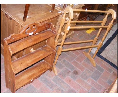 A towel rail together with a hanging display shelf