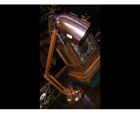 A mid century Terence Conran wood and copper tone lamp 