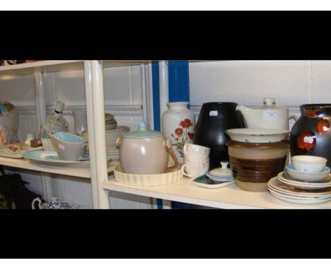 A collection of Poole Pottery including table lamp - on two shelves