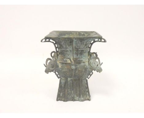 Chinese bronze ritual wine vessel of square form, with rams heads to each corner. Height 20cm