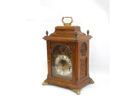 Good 20th century reproduction oak and burr walnut mantel clock with an arched dial having moon-phase aperture signed Christi