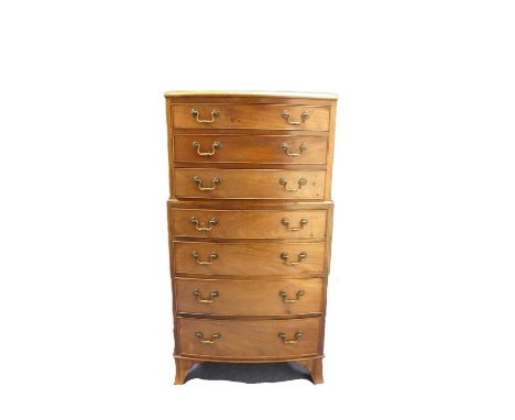 Late 19th century mahogany three over four bow front chest on chest, in the Georgian manner on turned bracket feet. Height 12