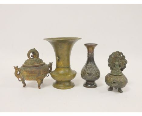 Bronze pouring vessel with seated deity, Chinese bronze vase with floral panels, a Chinese trumpet shaped vase, and a bronze 