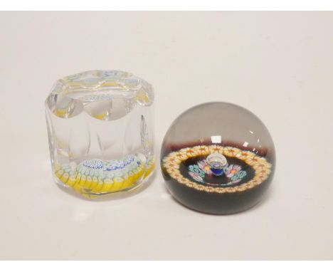 Two art glass paperweights, a Whitefriars faceted millefiori cylindrical paperweight dated 1974, and a Caithness Glass millie