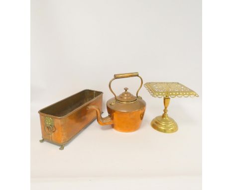 Victorian copper kettle; a copper rectangular planter with mask ring handles and claw feet and a pierced brass square trivet.