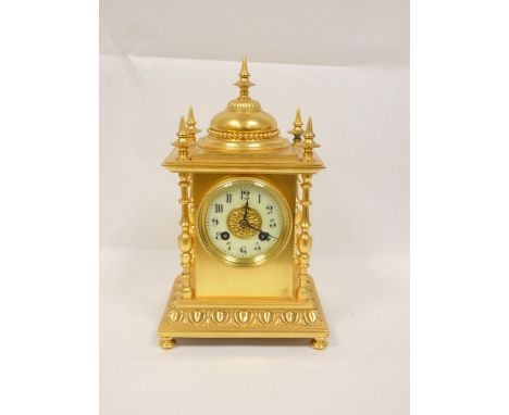 French gilt mantel clock in architectural style case with campana shaped top, columns and spike finial C1900, 29cm Condition 