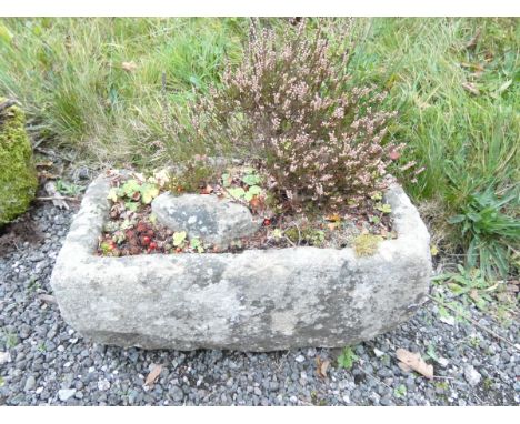 Antique carved sandstone trough. Height 26cm, Width 60cm, Depth 30cm.